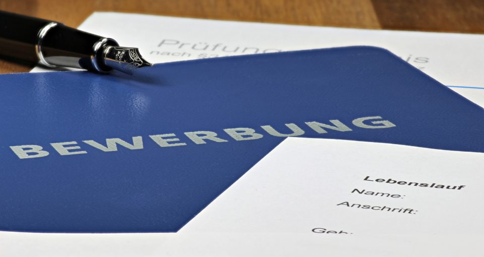 German job application file on desktop